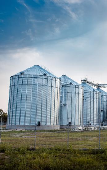 Grain silos in front of a blue sky
