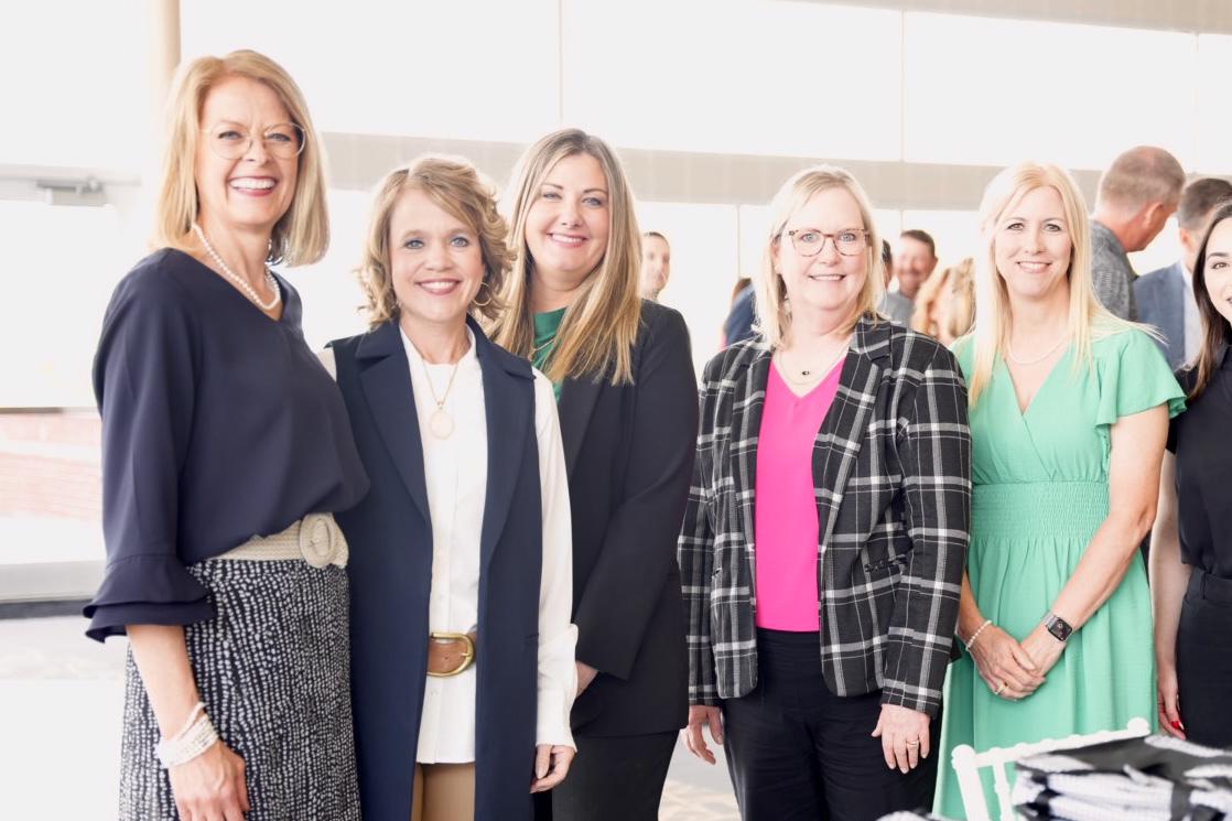 Lisa pictured with fellow staff members